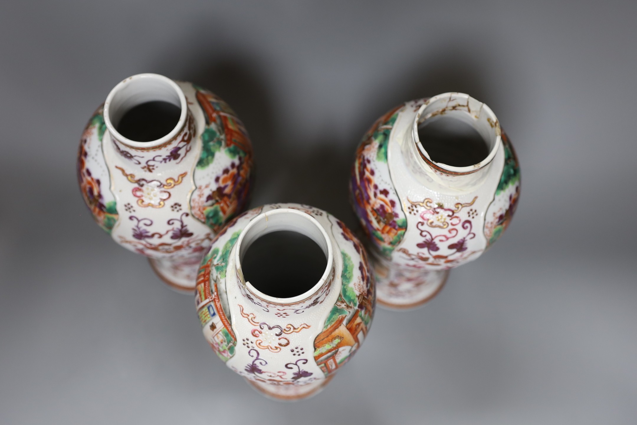A set of three Qianlong famille rose baluster vases, 24.5cm tall